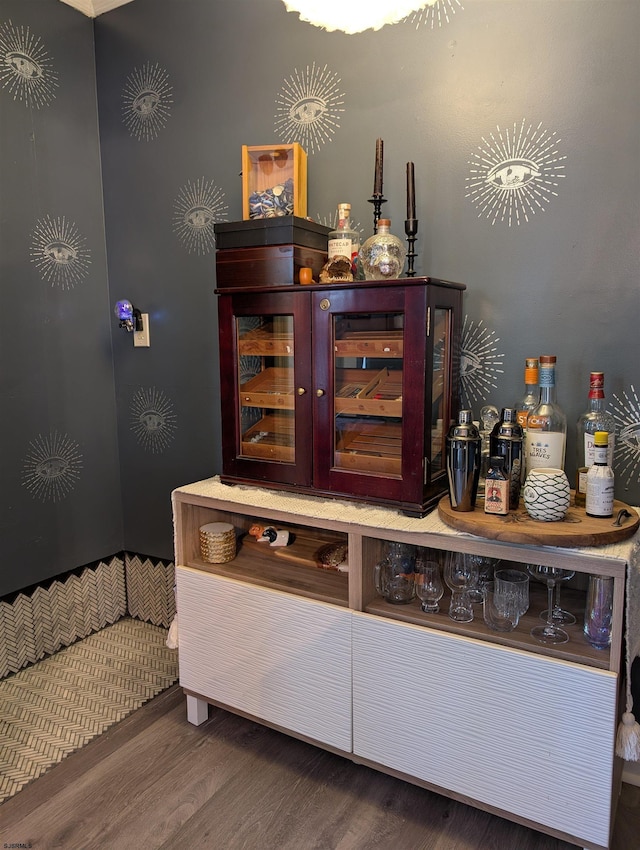 bar with hardwood / wood-style flooring