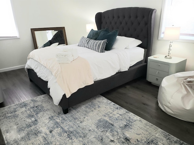 bedroom featuring dark wood-type flooring