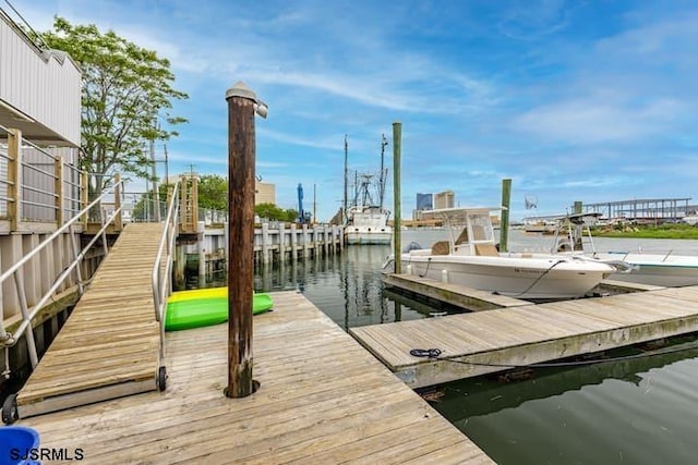 dock area featuring a water view