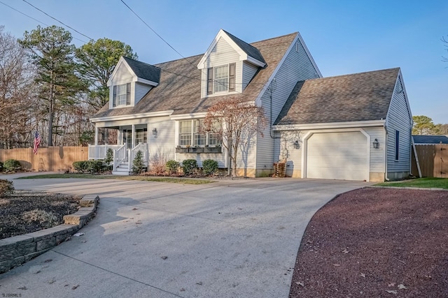 new england style home featuring a garage