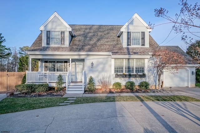 cape cod house featuring covered porch