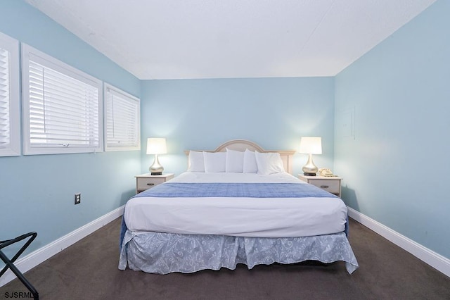 bedroom with dark carpet