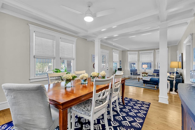 dining room with beamed ceiling, ceiling fan, light hardwood / wood-style flooring, and decorative columns