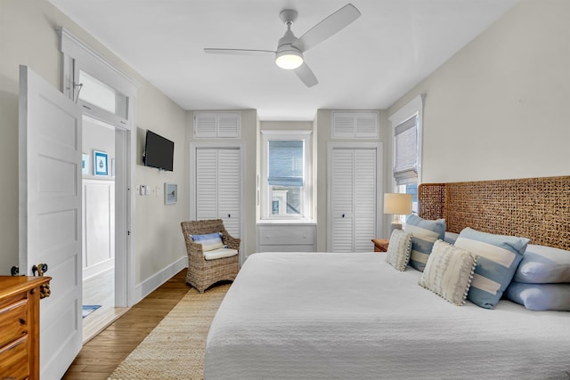 bedroom featuring ceiling fan, wood-type flooring, and a closet