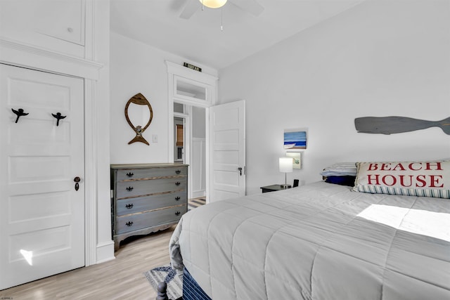 bedroom with light hardwood / wood-style flooring and ceiling fan