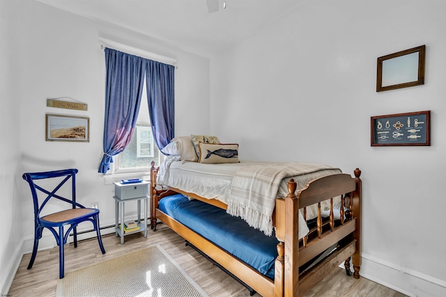 bedroom with wood-type flooring and ceiling fan