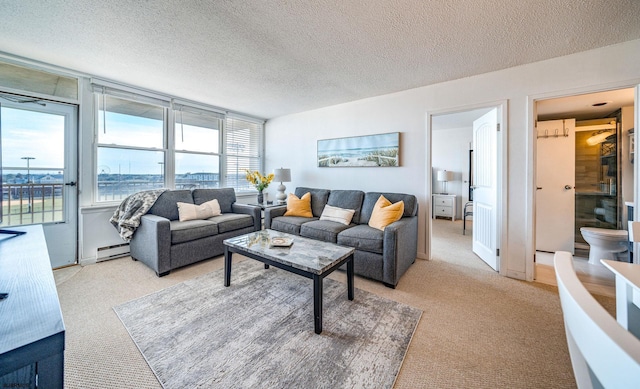 carpeted living room with a baseboard radiator and a textured ceiling