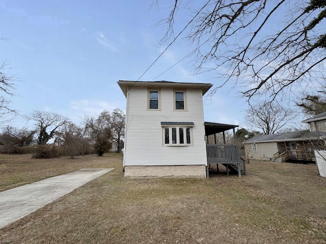 view of property exterior with a lawn