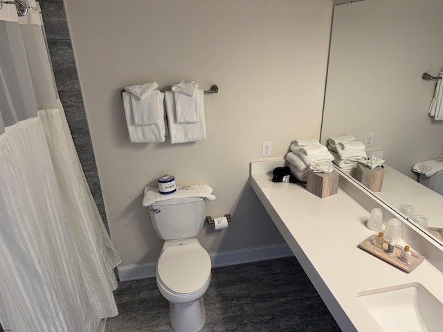 bathroom with toilet and walk in shower