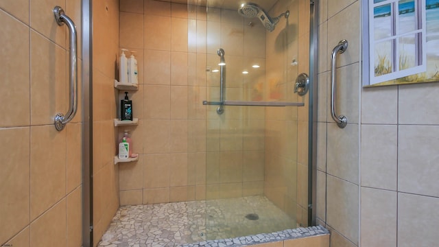 bathroom featuring an enclosed shower