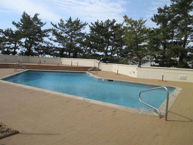 view of pool featuring a patio