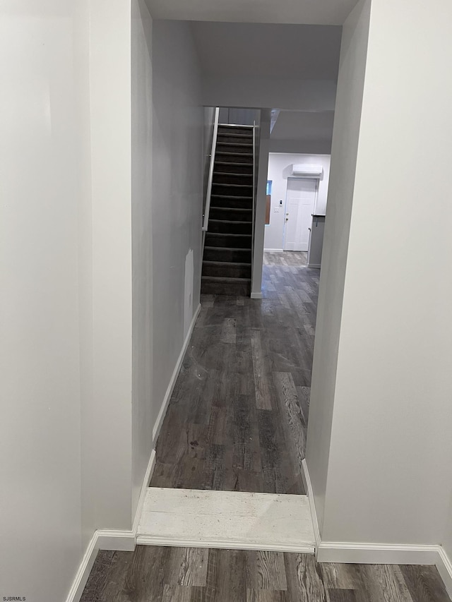 corridor featuring dark hardwood / wood-style floors