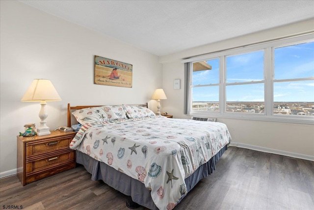 bedroom with dark wood-type flooring