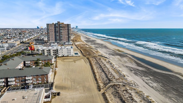 bird's eye view with a view of the beach and a water view