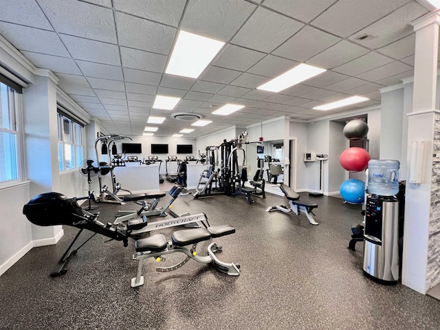 exercise room with a drop ceiling