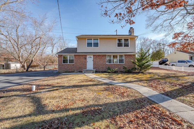 front facade with a front lawn