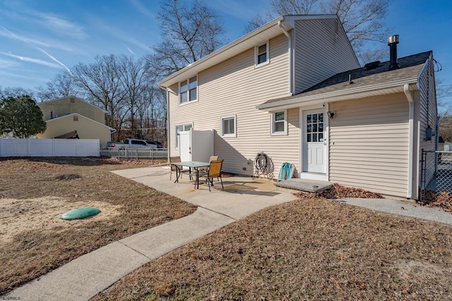 back of property featuring a patio