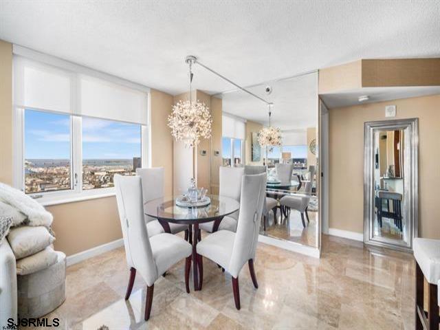 dining space with a chandelier