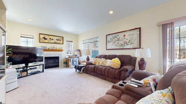 carpeted living room with a healthy amount of sunlight