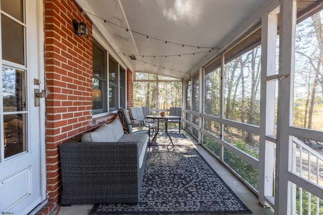 sunroom featuring track lighting