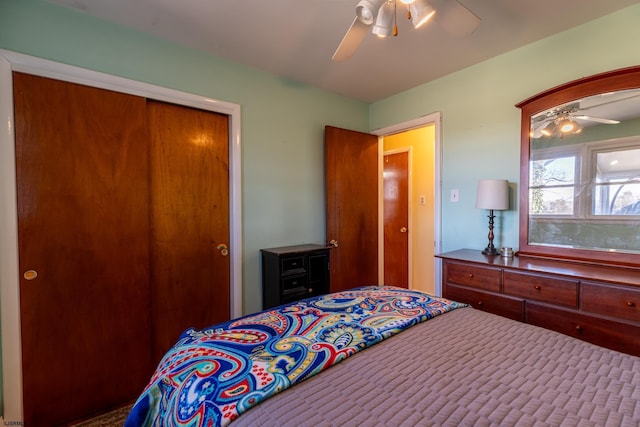 bedroom with ceiling fan and a closet