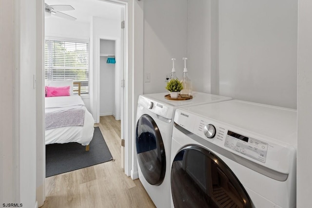 washroom featuring ceiling fan, washer and clothes dryer, and light hardwood / wood-style flooring