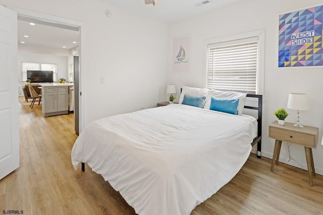 bedroom with light hardwood / wood-style flooring