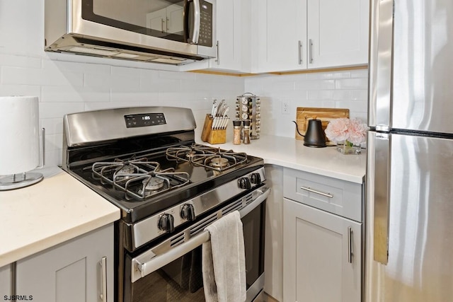 kitchen featuring tasteful backsplash and stainless steel appliances