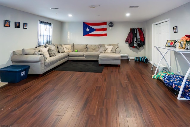 living room with dark hardwood / wood-style flooring