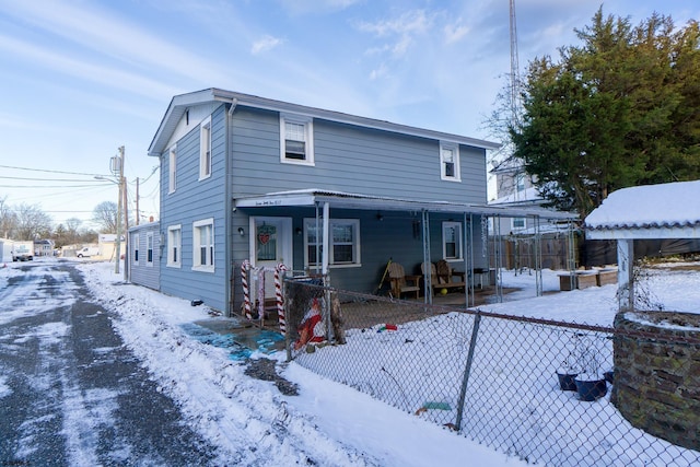 view of property featuring covered porch