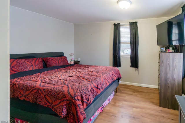 bedroom with light hardwood / wood-style floors