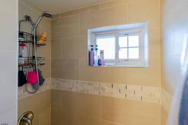 bathroom with tiled shower