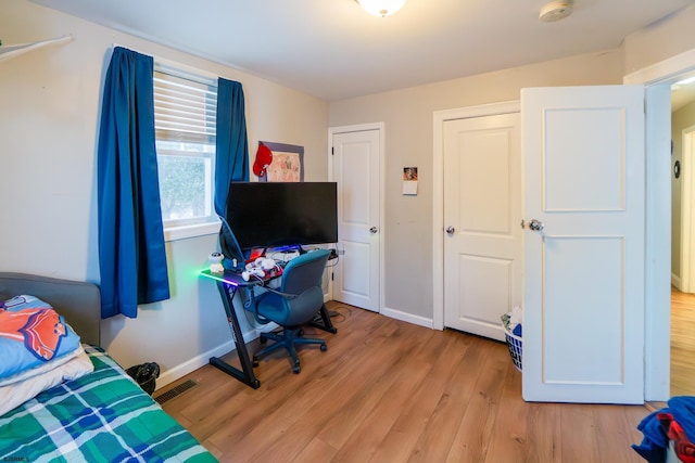 bedroom with light wood-type flooring