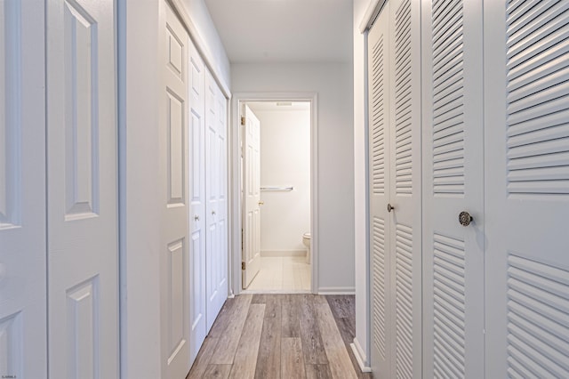 corridor featuring light wood-type flooring