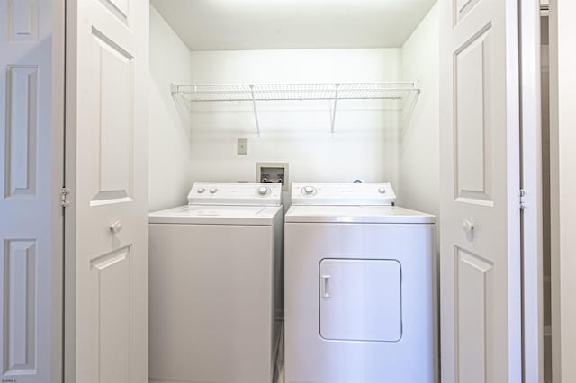 washroom featuring washer and clothes dryer