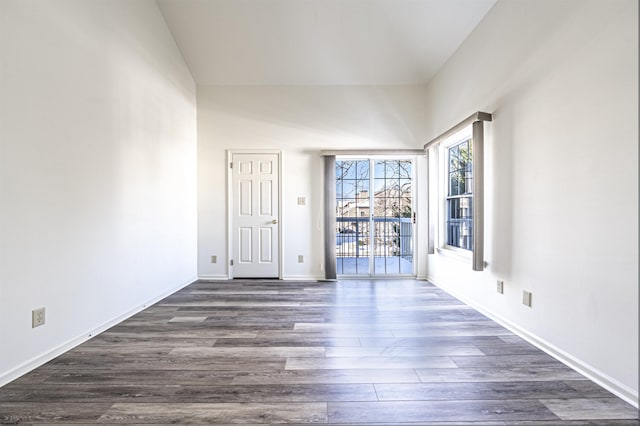 unfurnished room with dark hardwood / wood-style floors