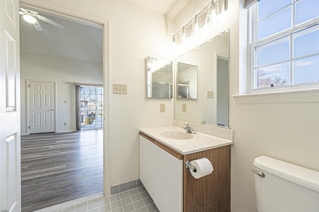 bathroom featuring tile patterned flooring, ceiling fan, toilet, and vanity