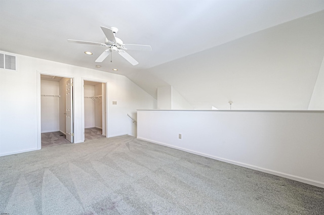 bonus room with light colored carpet, ceiling fan, and lofted ceiling