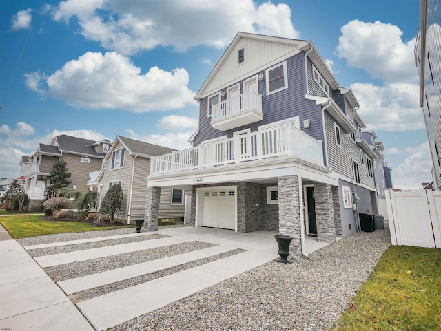 view of front of house with a balcony and a garage