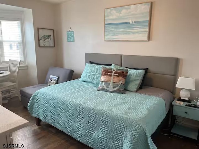 bedroom featuring dark hardwood / wood-style flooring