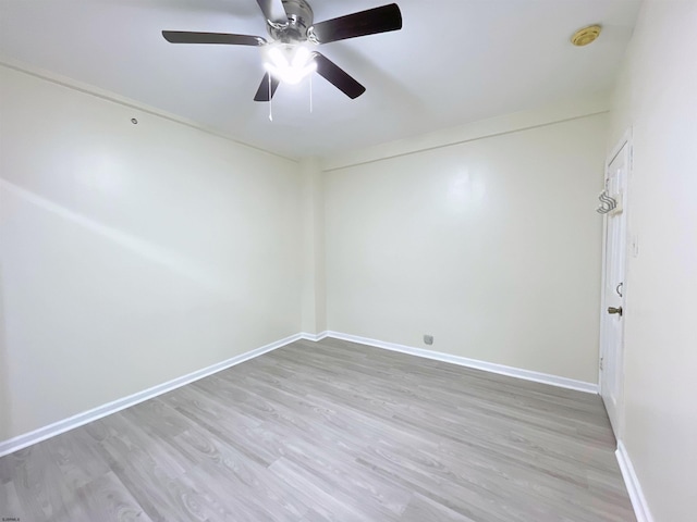 empty room featuring light hardwood / wood-style flooring and ceiling fan