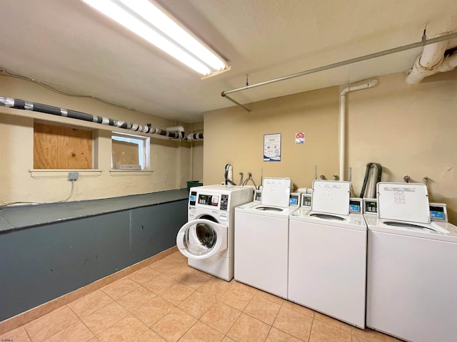 washroom with separate washer and dryer