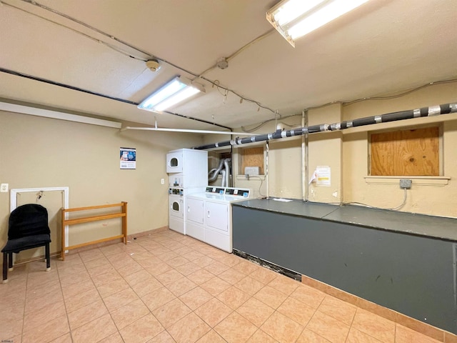 basement with independent washer and dryer and stacked washer and clothes dryer