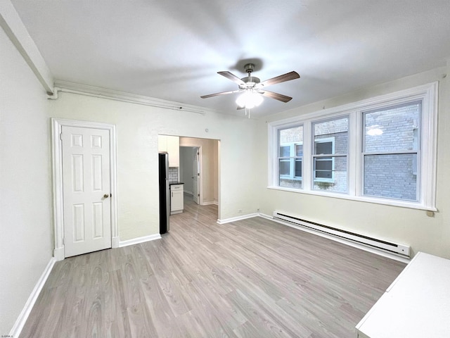 unfurnished bedroom with stainless steel fridge, ornamental molding, ceiling fan, a baseboard heating unit, and light hardwood / wood-style flooring