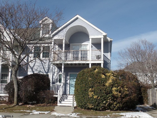 view of front of property with a balcony