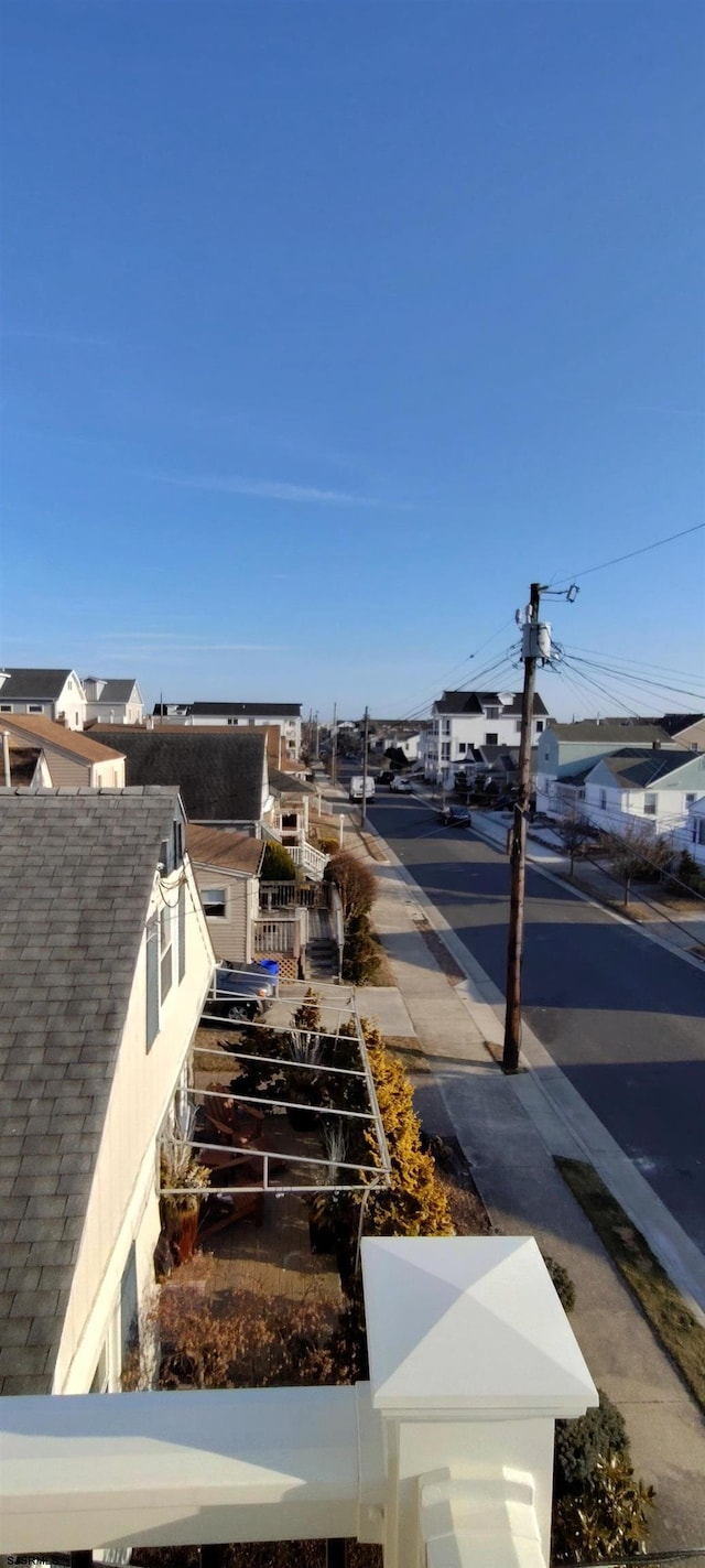 view of street featuring sidewalks and a residential view