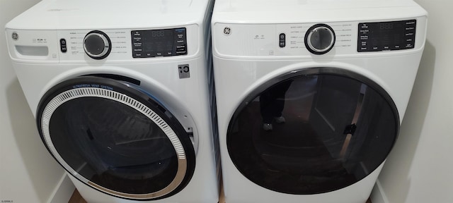 washroom with mail area, separate washer and dryer, and laundry area