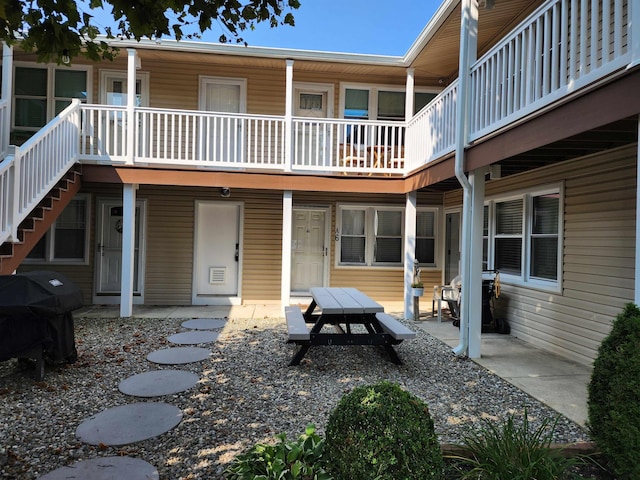 back of property featuring a patio area