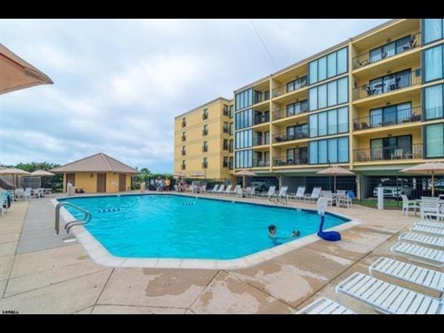 view of swimming pool with a patio area