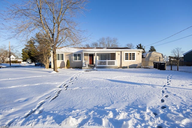 single story home featuring a porch